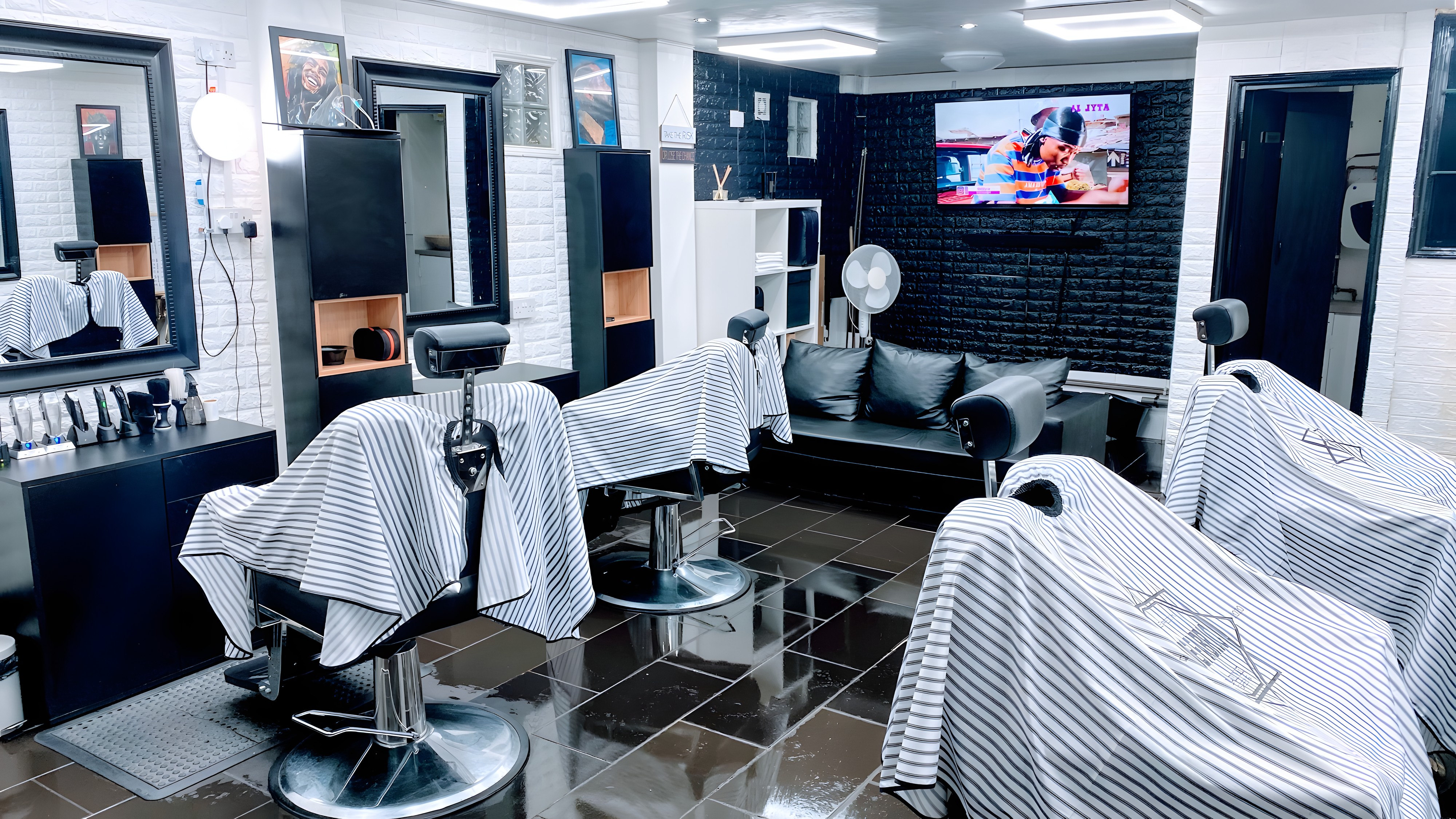 Inside Fade Fabric Barbers: barber chairs, mirrors and a bright cutting floor